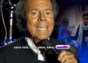 Captura de pantalla de un video viral en YouTube que muestra la cara falsa de Julio Iglesias junto a dos personas palestinas